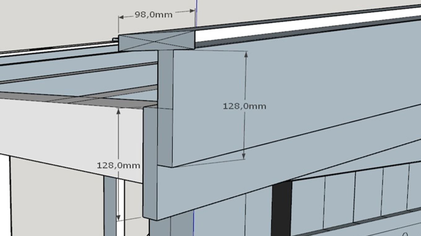 Nærbilde av en takkonstruksjon i tre. Illustrasjonen viser målangivelse for vindskier og raftbord – 128 mm i høyde og 98 mm i bredde – som del av bodens yttervegg og takramme.